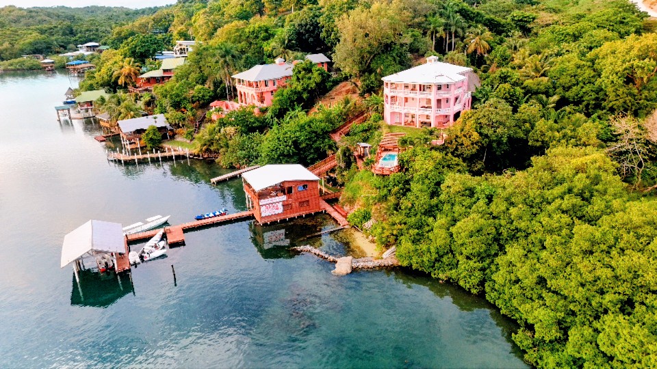 The dock at El Palacio Rosa on Carib Bight, Roatán, from above